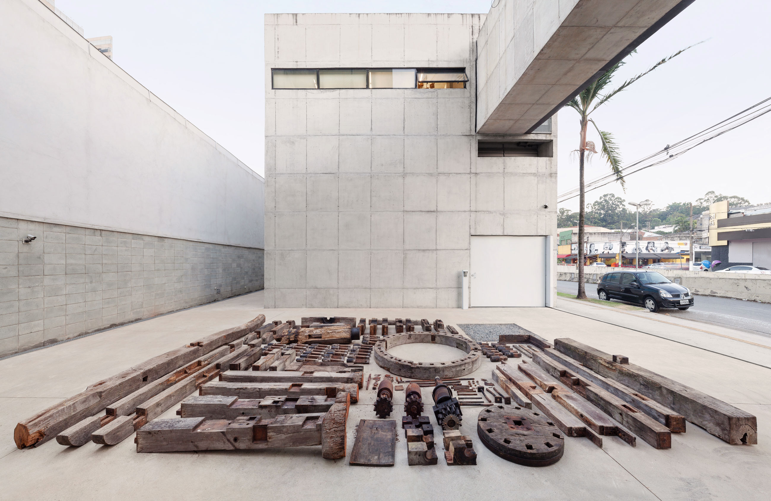 Site-specific Installation titled Phantom Matrix by artist Beto Shwafaty consisting of Sugarcane mill, electric motor, loudspeaker and audio, curated by Bruno Alves de Almeida for the project SITU at Galeria Leme, São Paulo, Brazil.