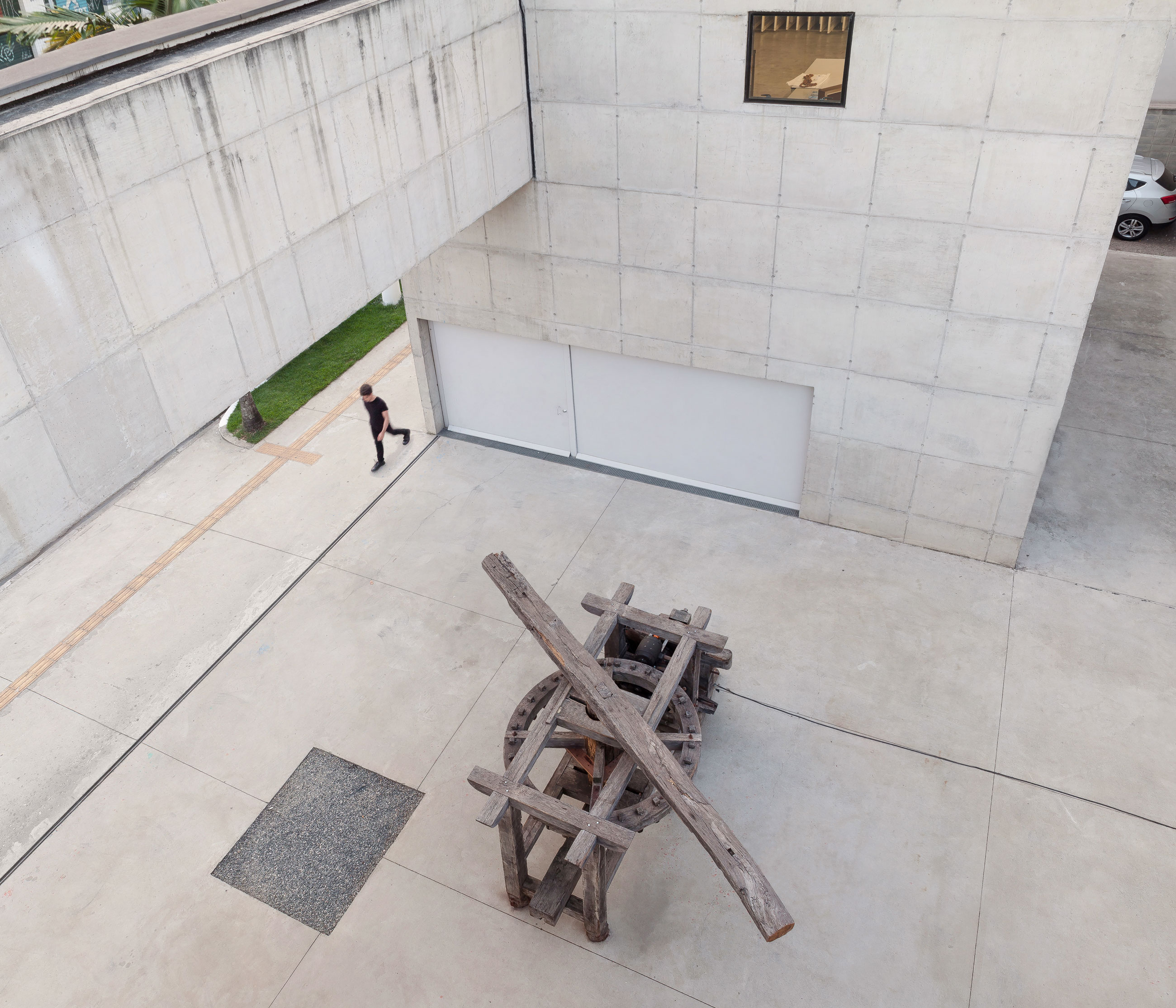 Site-specific Installation titled Phantom Matrix by artist Beto Shwafaty consisting of Sugarcane mill, electric motor, loudspeaker and audio, curated by Bruno Alves de Almeida for the project SITU at Galeria Leme, São Paulo, Brazil.