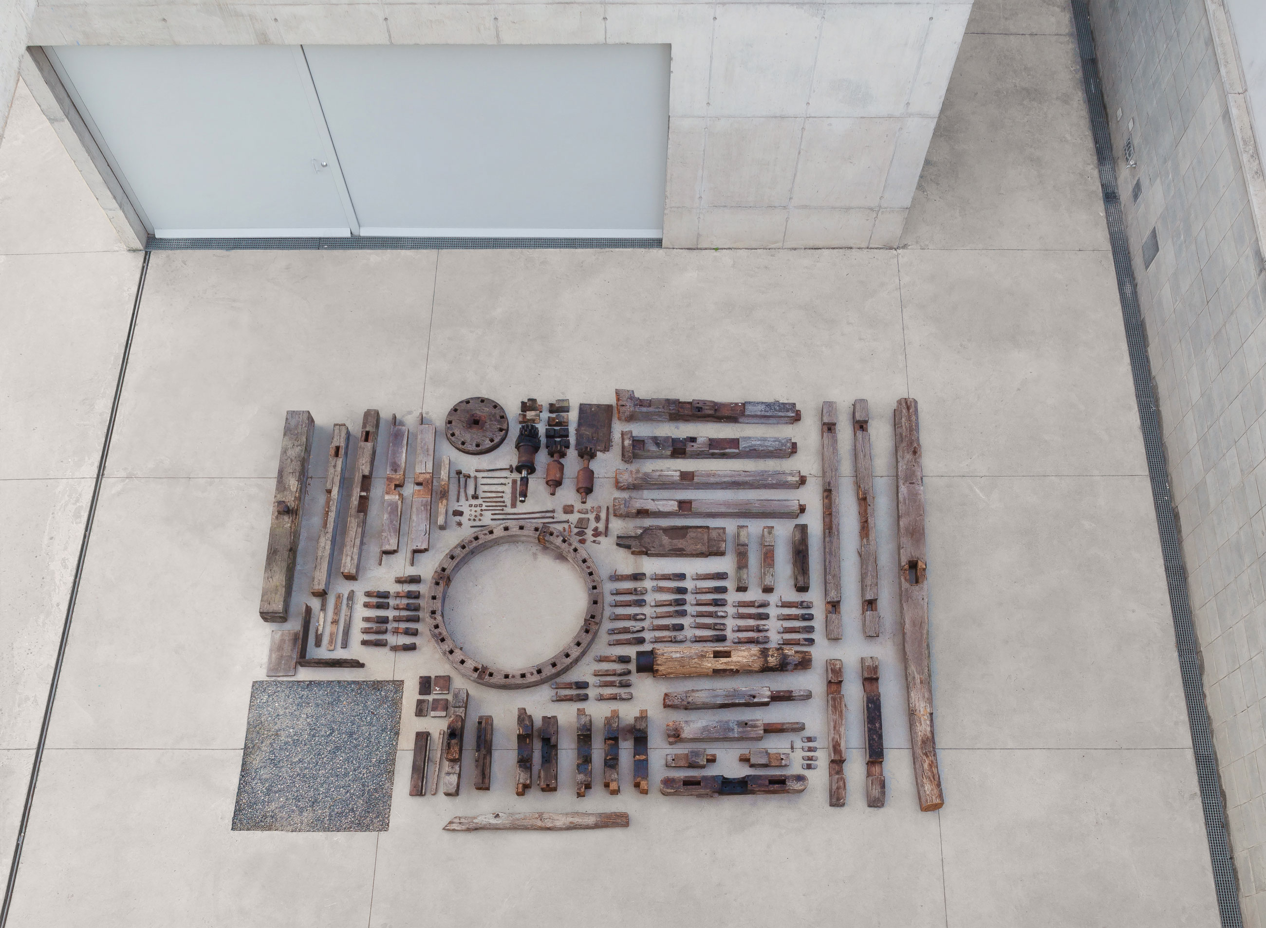 Site-specific Installation titled Phantom Matrix by artist Beto Shwafaty consisting of Sugarcane mill, electric motor, loudspeaker and audio, curated by Bruno Alves de Almeida for the project SITU at Galeria Leme, São Paulo, Brazil.